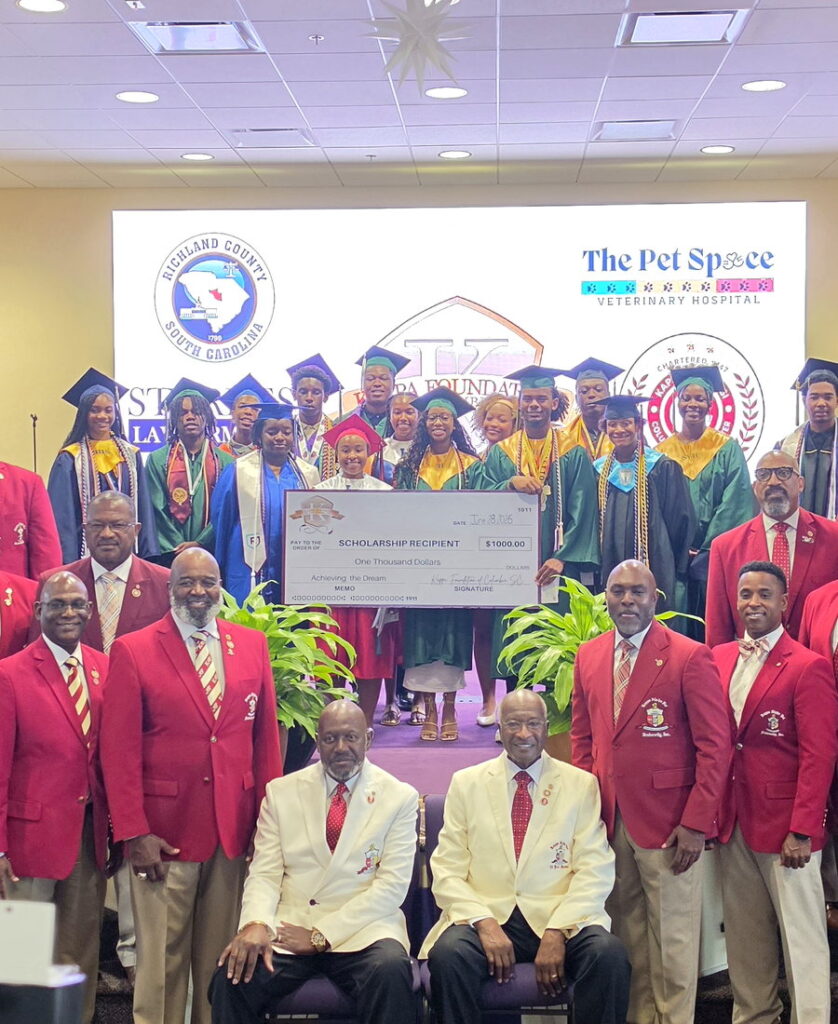 Columbia (SC) Alumni Chapter brothers presenting scholarship awards to graduating seniors with the Kappa Foundation of Columbia, SC